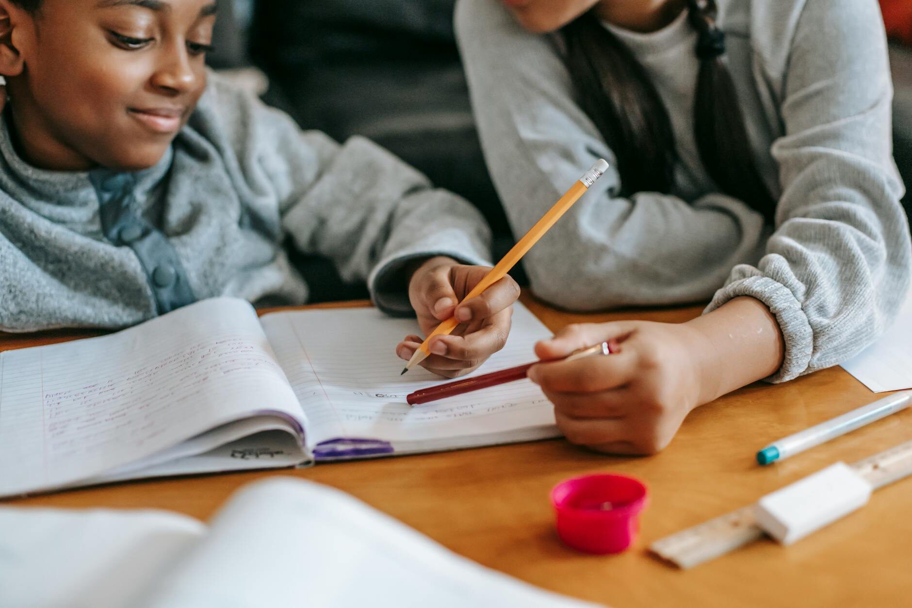 crop kids doing homework together